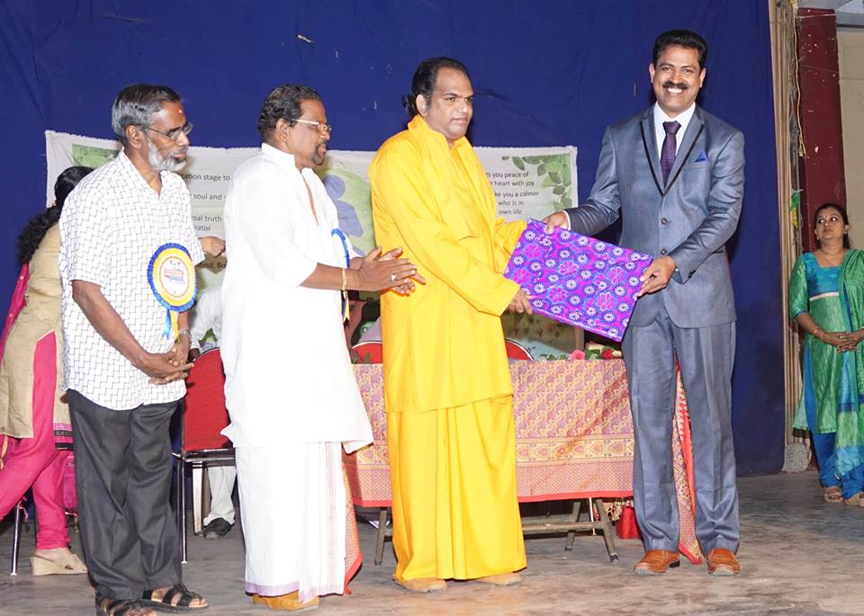 Receiving Award from Santhigiri Ashram
